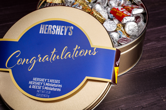 Image of HERSHEY'S Assortment Gift Tin with Congratulations Sleeve 2 lbs. tin Packaging