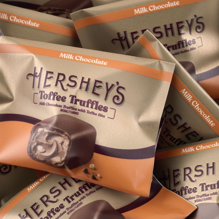 Image of HERSHEY'S Caramels and Milk Chocolate Toffee Truffles Gold Gift Tower Packaging