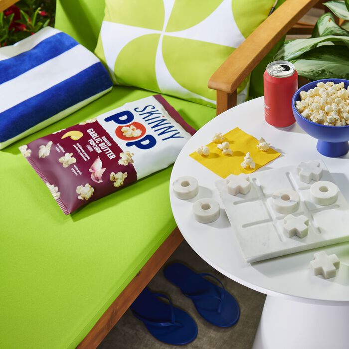 Image of SKINNYPOP Roasted Garlic Butter Flavored Popcorn, 4.4 oz bag Packaging