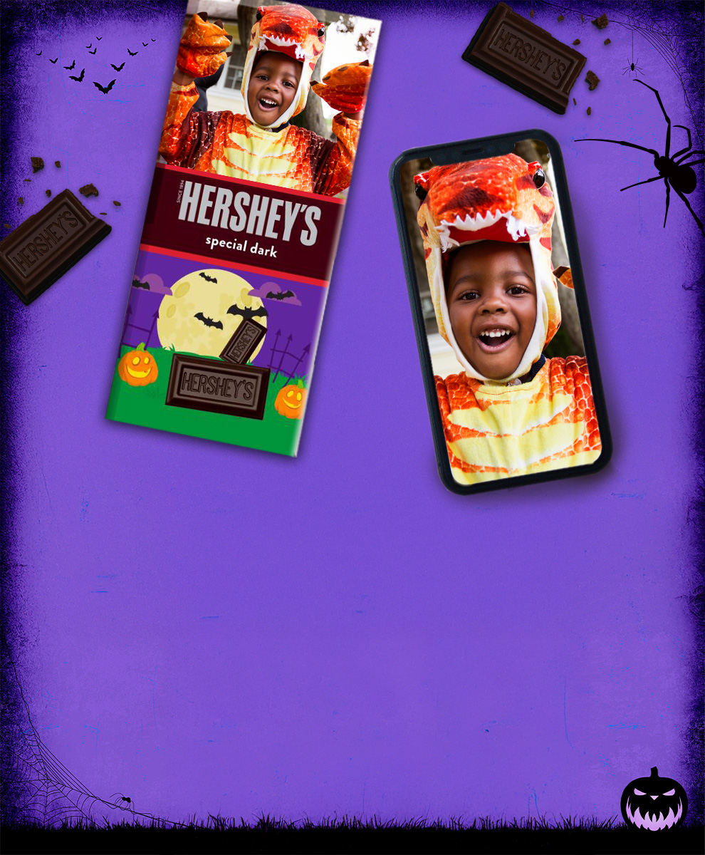 HERSHEY'S Bar with personalized Halloween-themed wrapper next to an iPhone