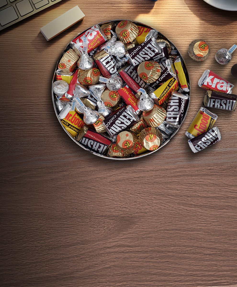Promotional graphic featuring Hershey's and Reese's Treats in a gift tin