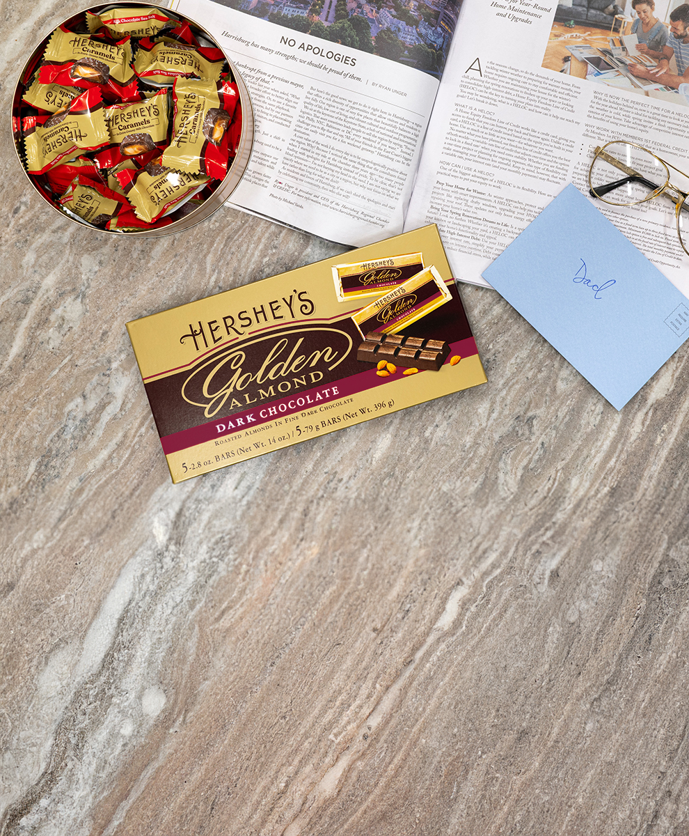 Promotional graphic featuring HERSHEY's Caramels and HERSHEY's Golden Almond Dark Chocolate Bar giftbox for father's day gifts