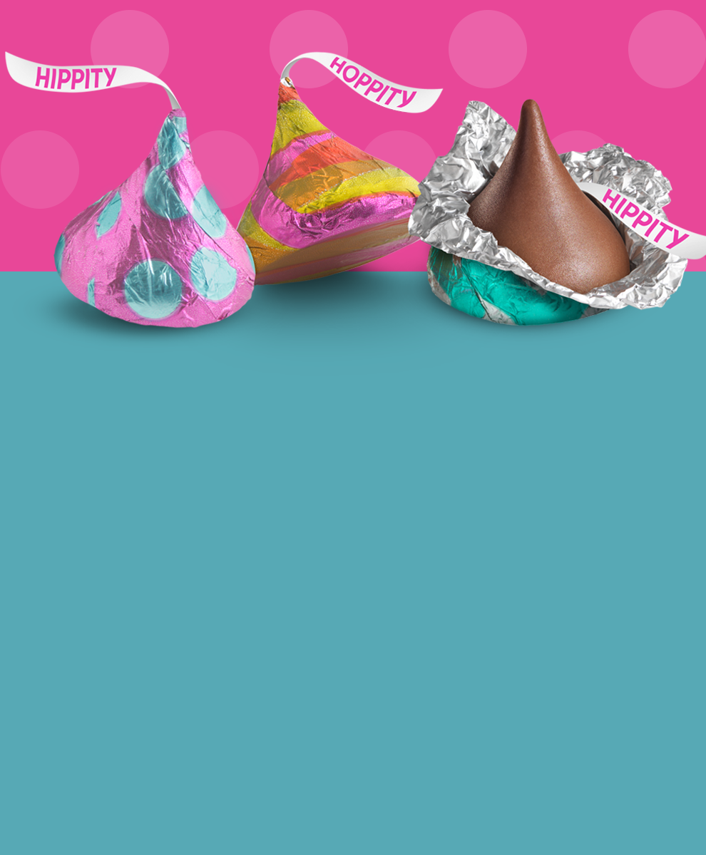 KISSES Chocolate in Easter Foils on pink and blue spring-themed background