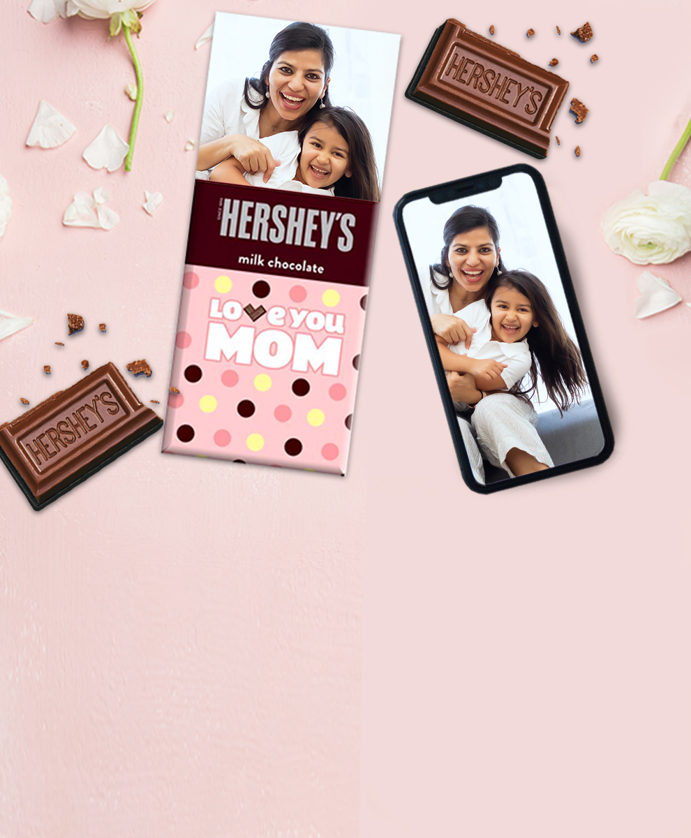 HERSHEY'S Bar with Easter-themed wrapper next to an iPhone