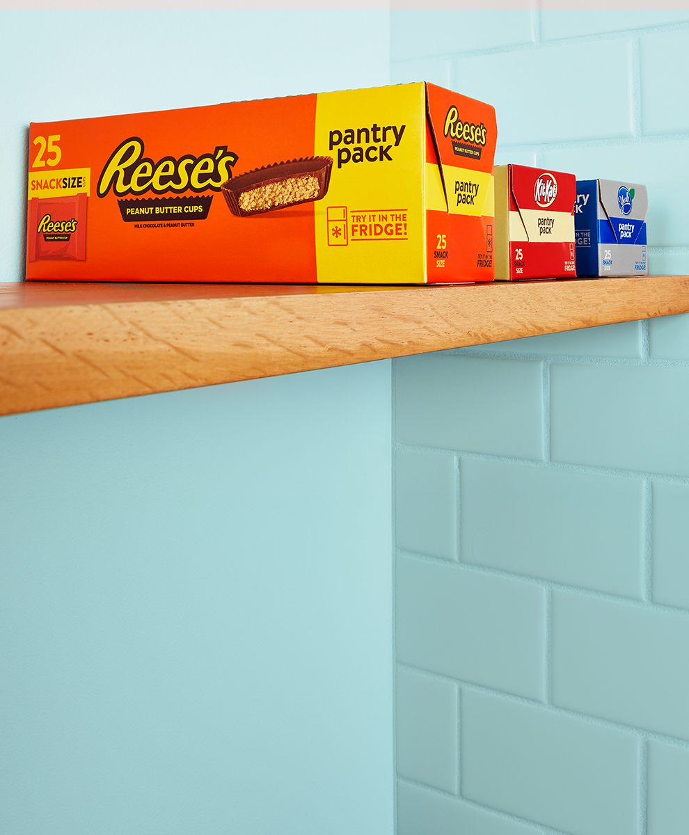 HERSHEY'S and KIT KAT® and YORK pantry candy packs on a wooden shelf