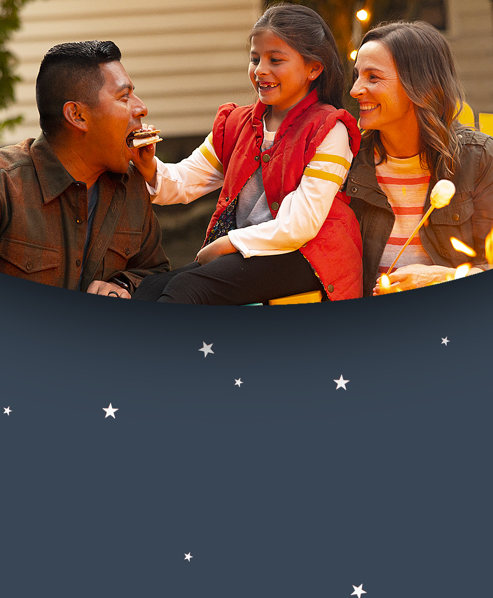 Promotional graphic featuring Hershey's S'mores enjoyed by a father and daughter by a campfire