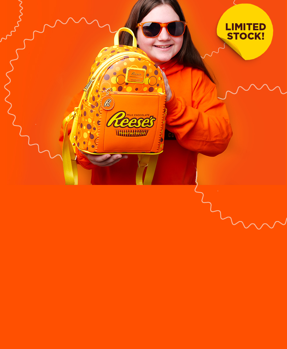 Girl in sunglasses posing with the REESE'S Loungefly Mini Backpack