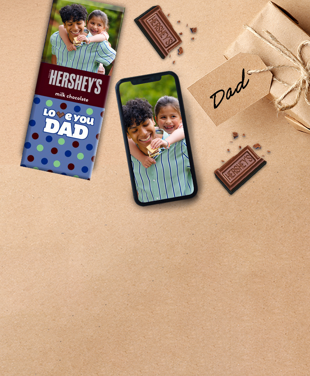 HERSHEY'S Bar with chocolate pieces and a dad gift sitting on a table