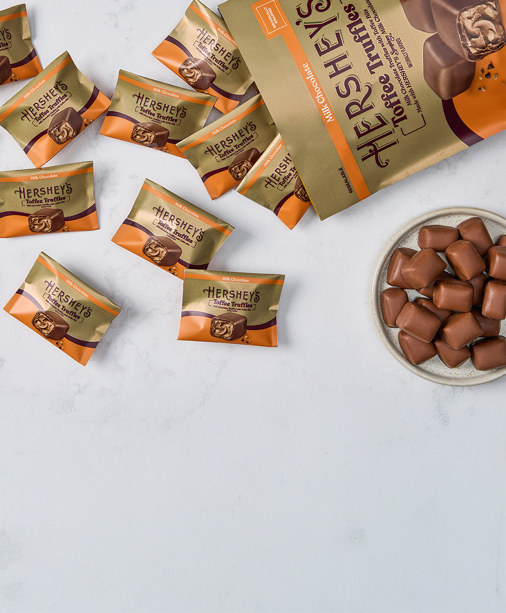 Promotional graphic featuring HERSHEY'S Toffee Truffles on a marble serving tray