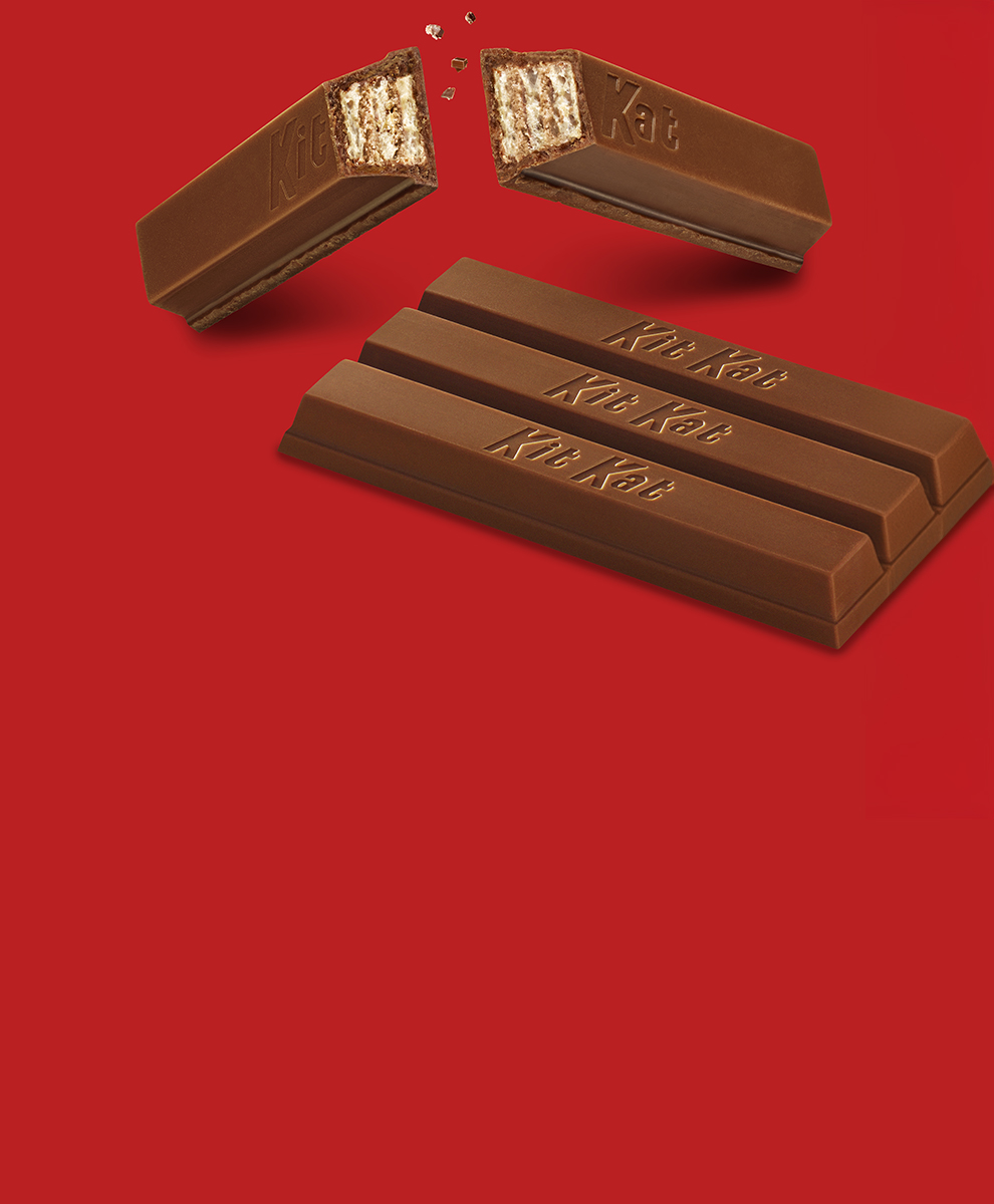 Broken and in tact KIT KAT® bars on a red background