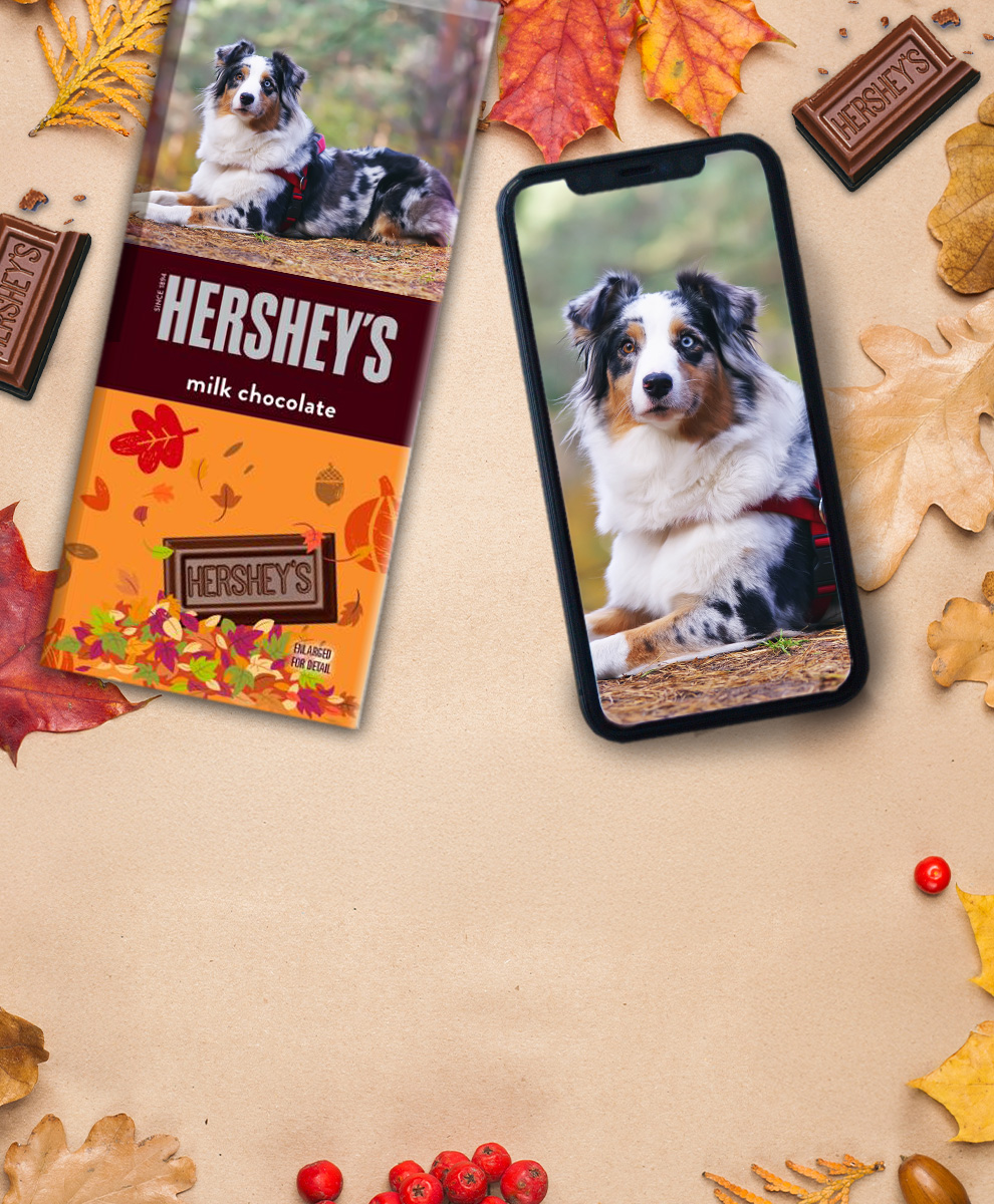 HERSHEY'S Bar with personalized Fall-themed wrapper next to an iPhone