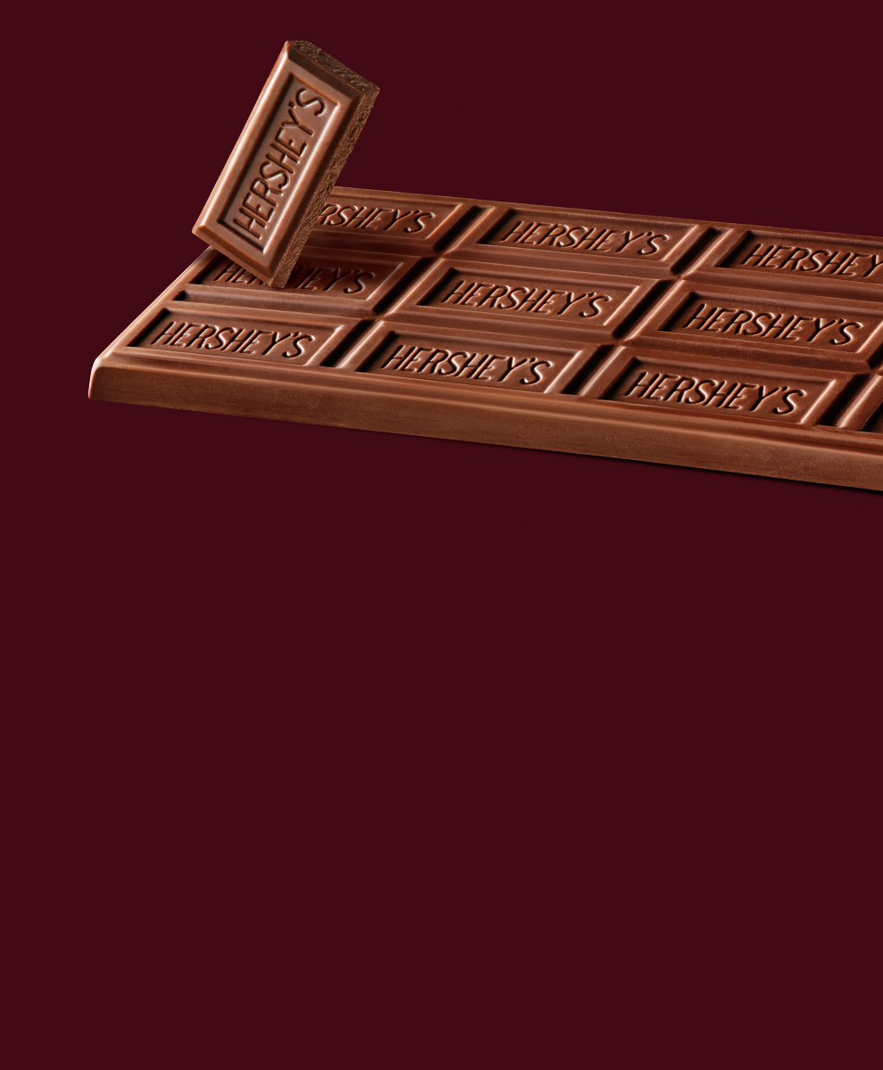 HERSHEY'S milk chocolate bar on a brown background