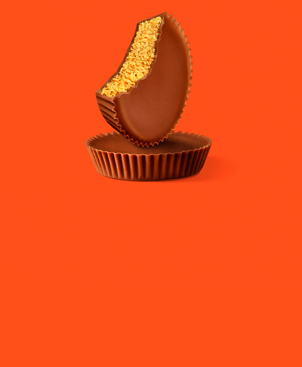REESE'S Peanut Butter Cups on an orange background