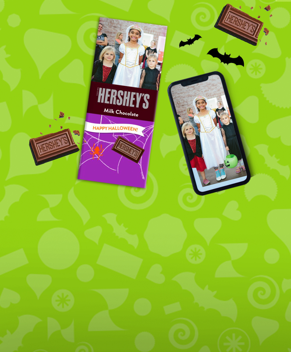 Halloween-themed Personalized HERSHEY'S Chocolate Bar next to smartphone