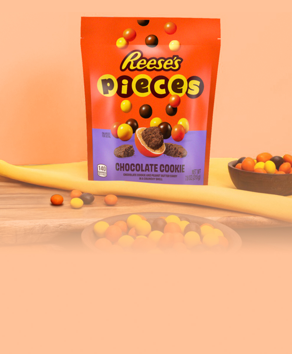 Promotional graphic featuring REESE'S PIECES Candies with cookie center