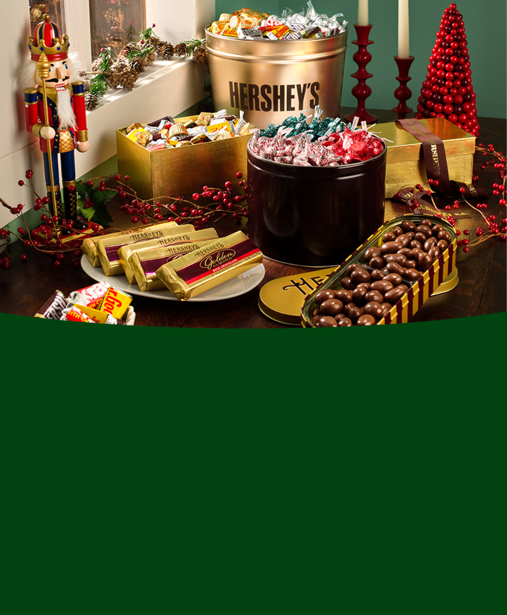 Exclusive Hershey Holiday Tins and treats on a festive dessert table