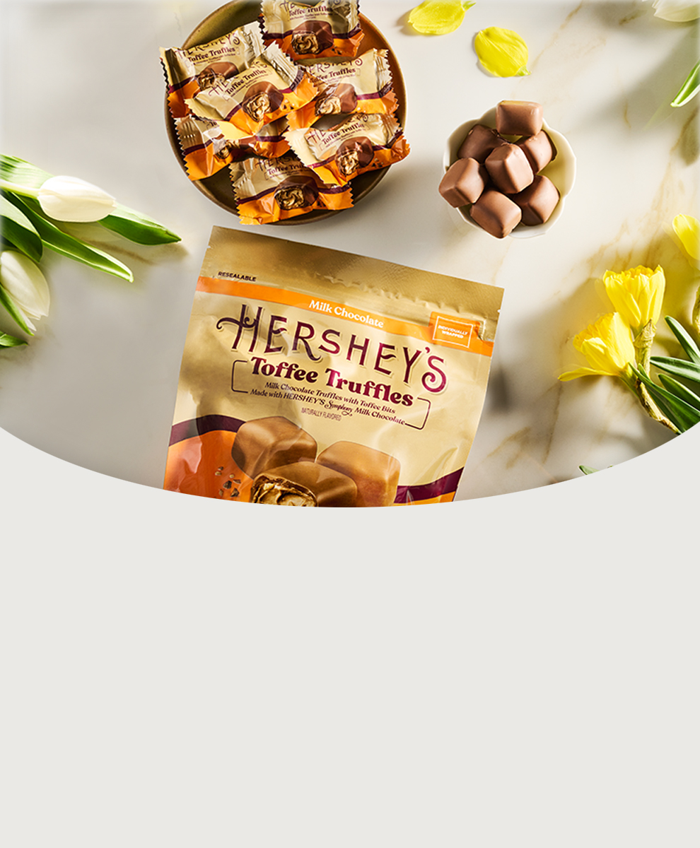 Promotional graphic featuring Hershey's Toffee Truffles spilling out on table