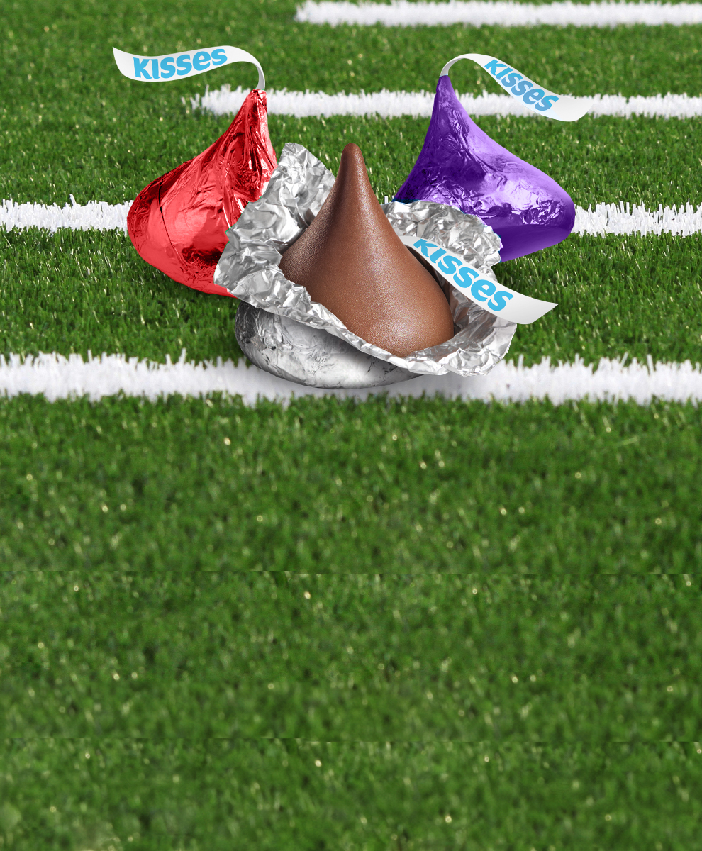 HERSHEY'S Kisses in colored foils coordinated with team colors on a football field