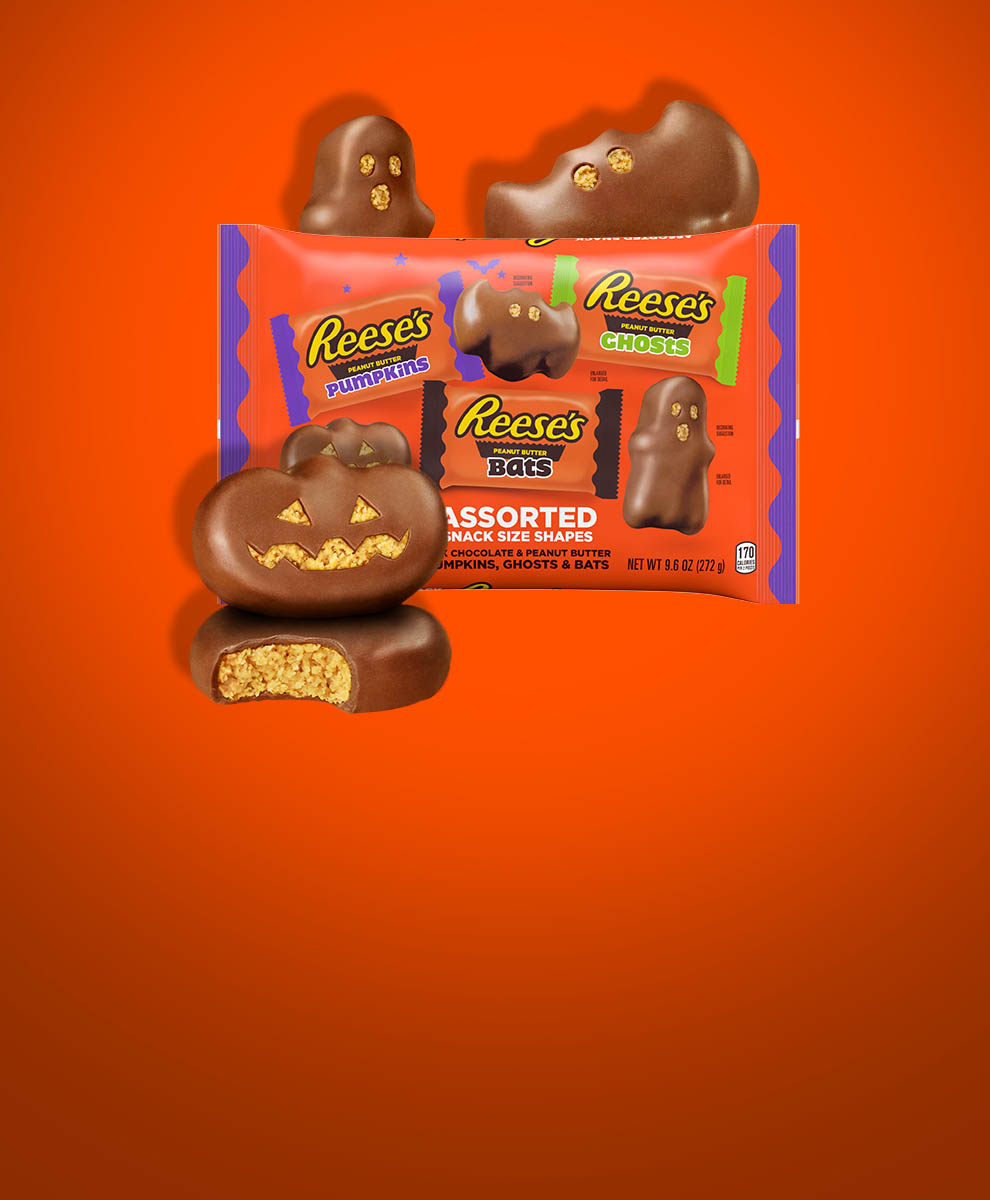 A REESE’S Peanut Butter pumpkin, bat and ghost surrounding a 9.6 ounce package of assorted snack size shapes.