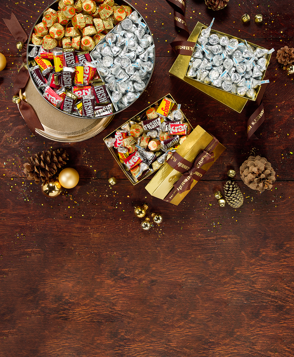 Wrapped HERSHEY'S Golden Almond Bars displayed on holiday tabletop