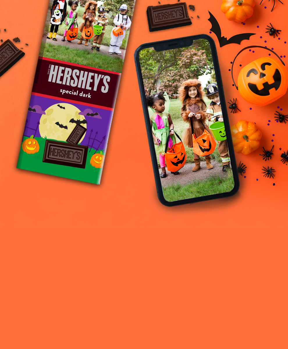 HERSHEY'S Bar with personalized Halloween-themed wrapper next to an iPhone