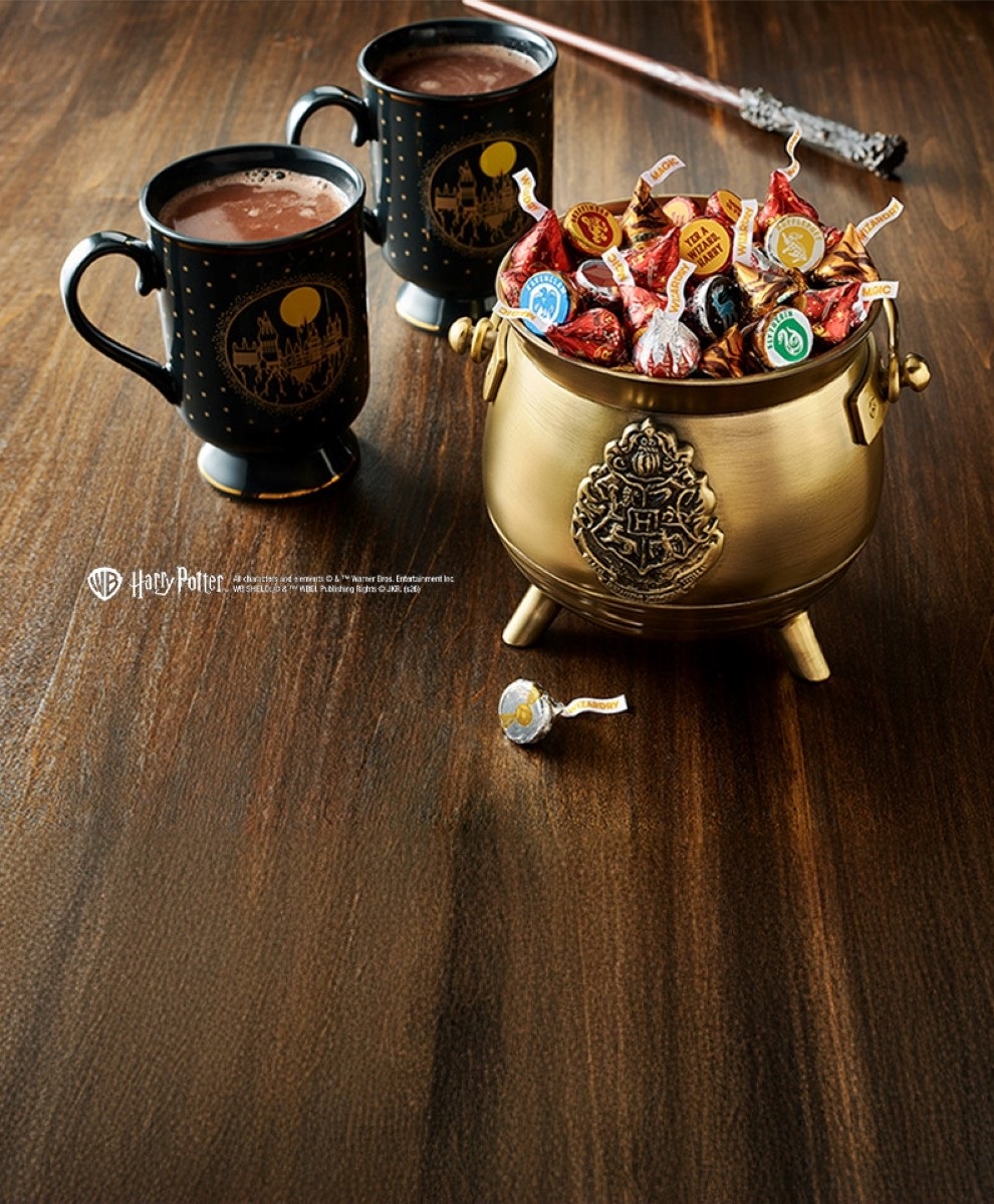 Promotional graphic showing HERSHEY'S Harry Potter™ Kisses in a bowl on a tabletop