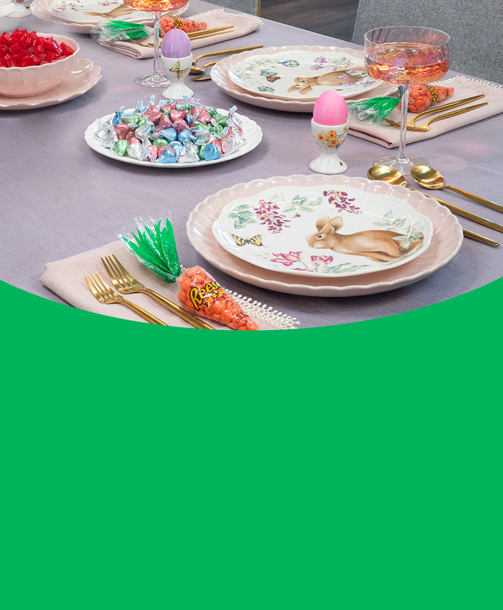 Tabletop set with Easter-themed dinnerware and TWIZZLERS and HERSHEY'S KISSES candy