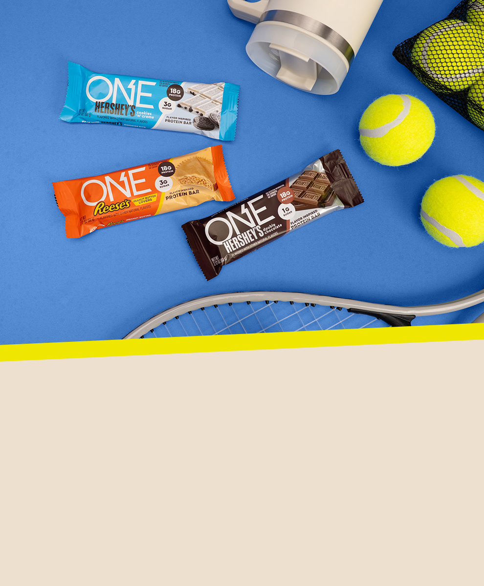 Promotional graphic featuring assorted ONE Protein Bars on a blue background