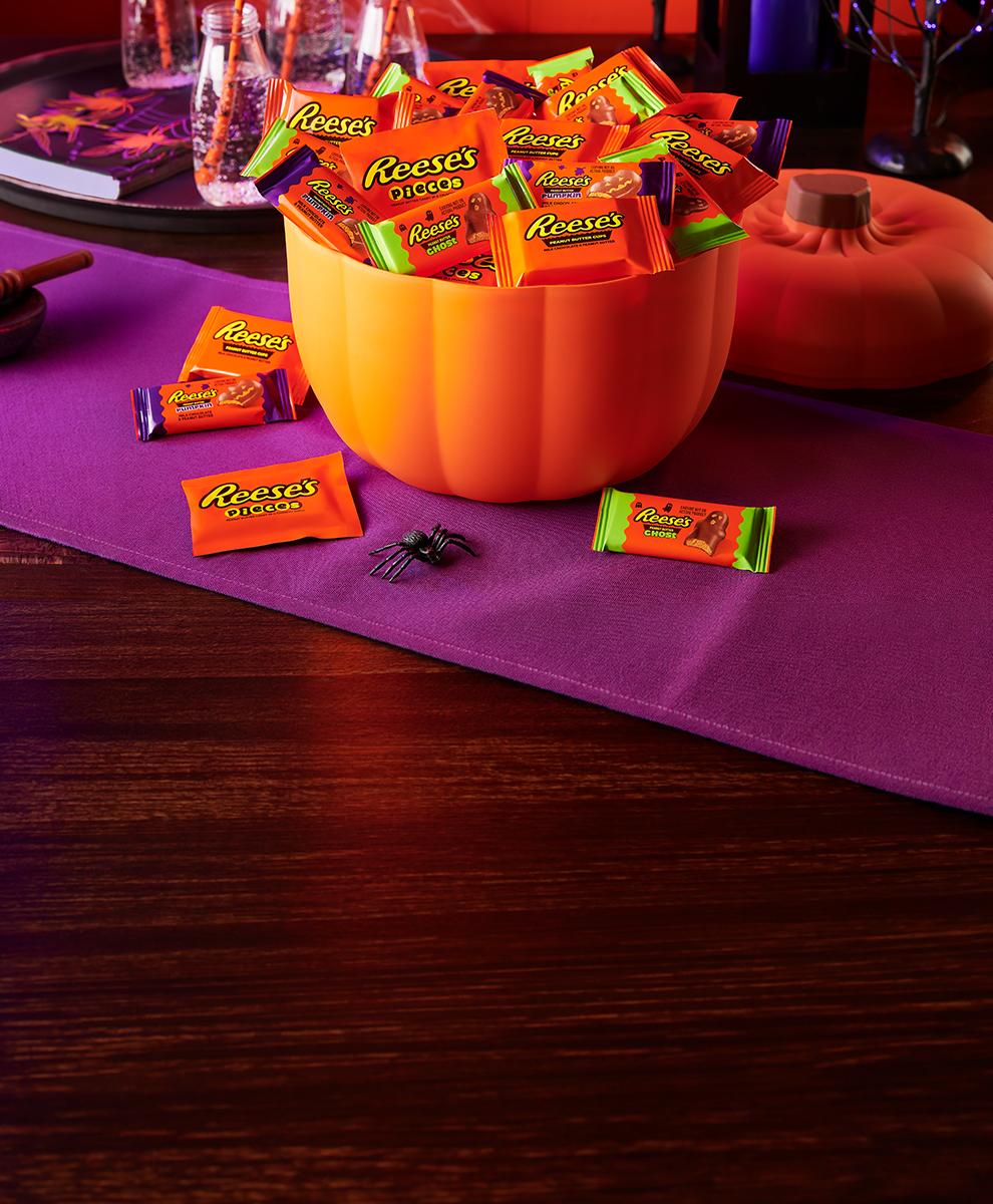 Promotional graphic featuring Halloween candies with a monster packaging