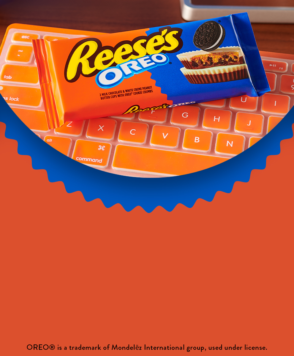 Promotional graphic featuring a pack of REESE'S OREO® Peanut Butter Cup sitting on a desk with a computer keyboard