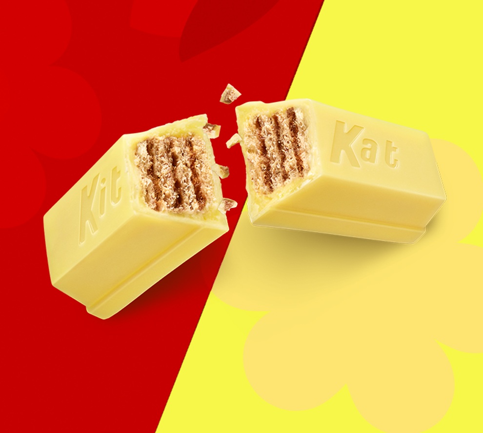 Promotional graphic showing lemon Kit Kat broken open to show wafer inside