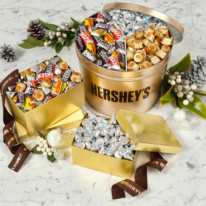 HERSHEY'S candy filled gold gift tins on a marble countertop