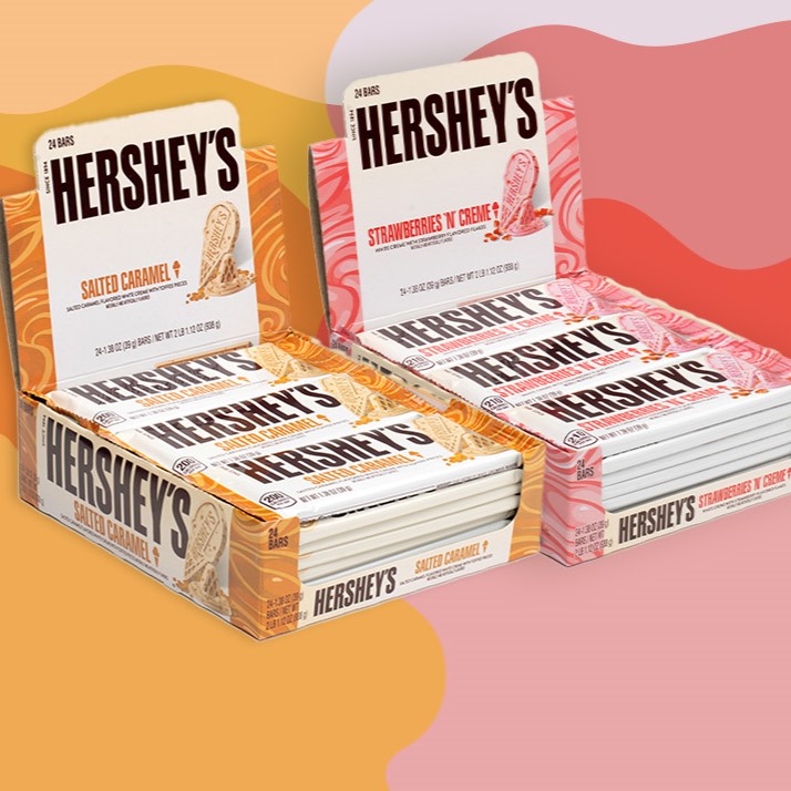 Promotional graphic featuring boxes of HERSHEY'S Salted Caramel and Strawberries & Creme Ice Cream Flavored Candy Bars