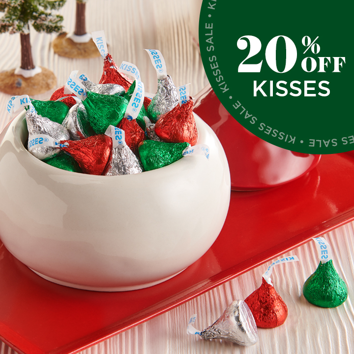HERSHEY'S Kisses in Red and Green and Silver Foils On Top Of Christmas Themed Servingware