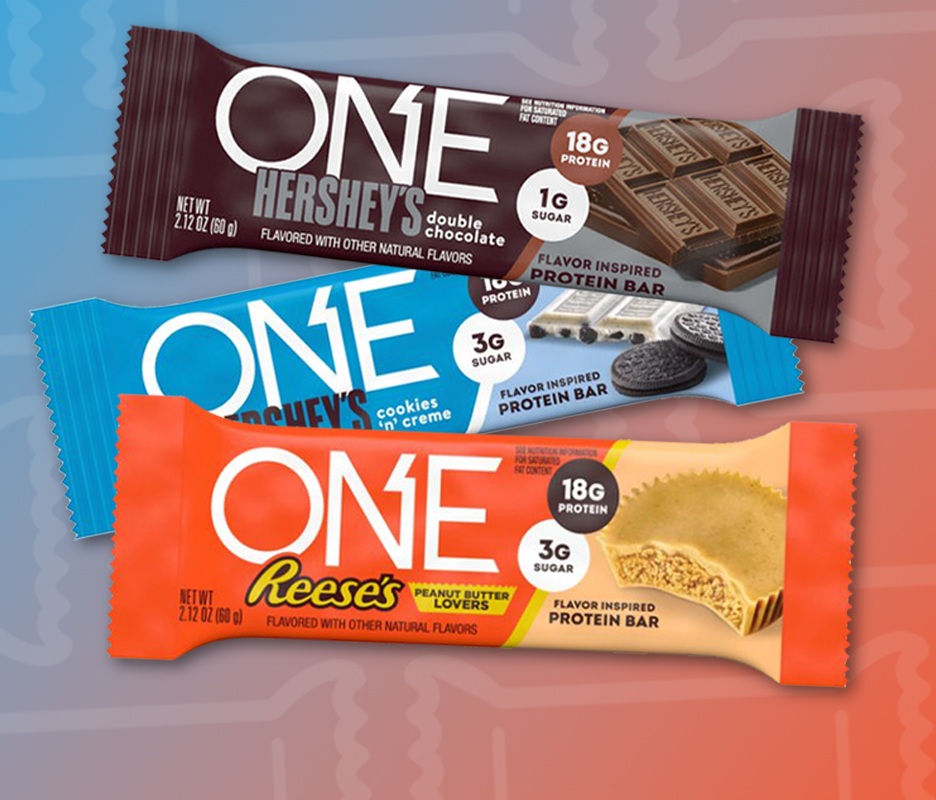 Promotional graphic showing a one protein bars IN HERSHEY, REESES AND COOKIES 'N CREAM FLAVORS