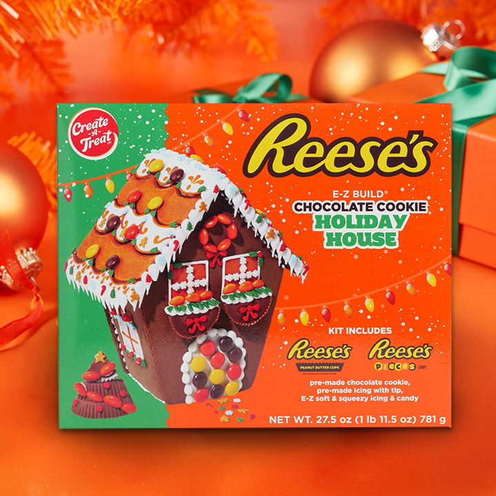 REESE'S Chocolate Cookie Holiday House in packaging on gift background