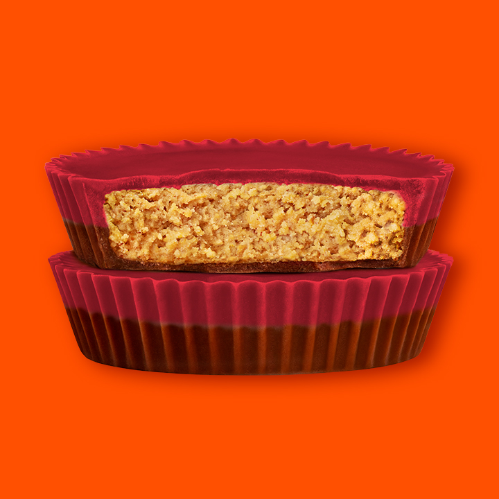 Promotional graphic showing REESE'S Red Velvet Milk Chocolate Peanut Butter Cups in a stack