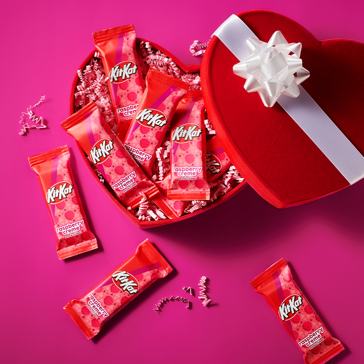 KIT KAT Raspberry Creme candies in a partially opened heart-shaped Valentine's Day gift box