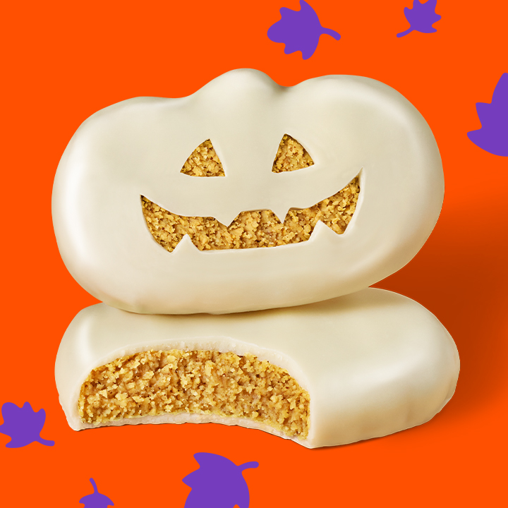 Promotional graphic featuring REESE'S White Peanut Butter Pumpkins on an orange background