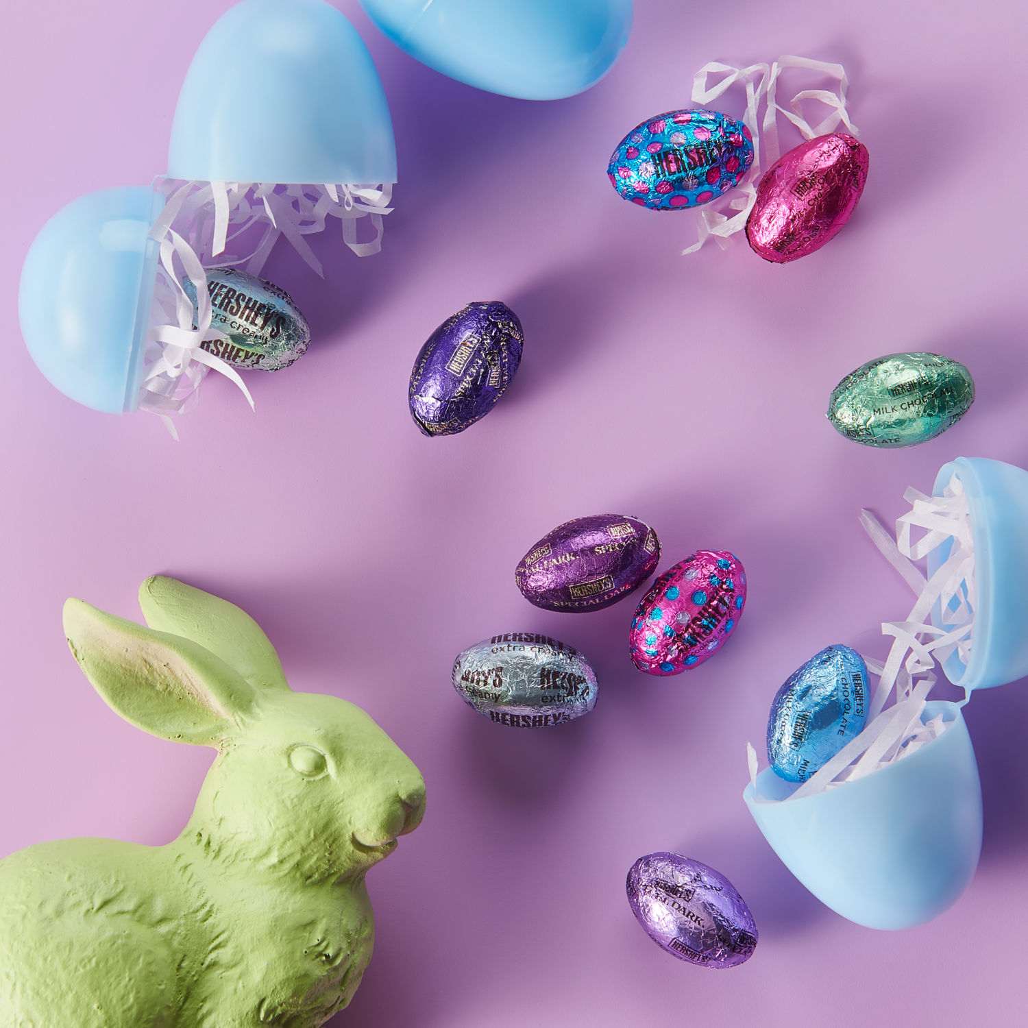 Promotional graphic featuring HERSHEY'S Milk Chocolate Cookies and Cream and Dark Chocolate eggs in an Easter bunny candy dish 