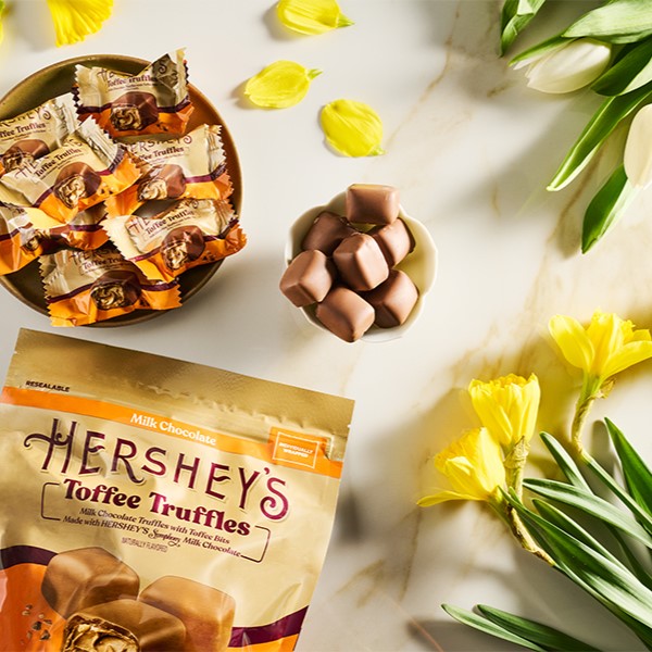 HERSHEY'S Toffee Truffles displayed amongst floral arrangements on a countertop
