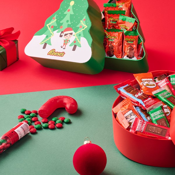 Holiday-themed gifts displayed on a red and green background