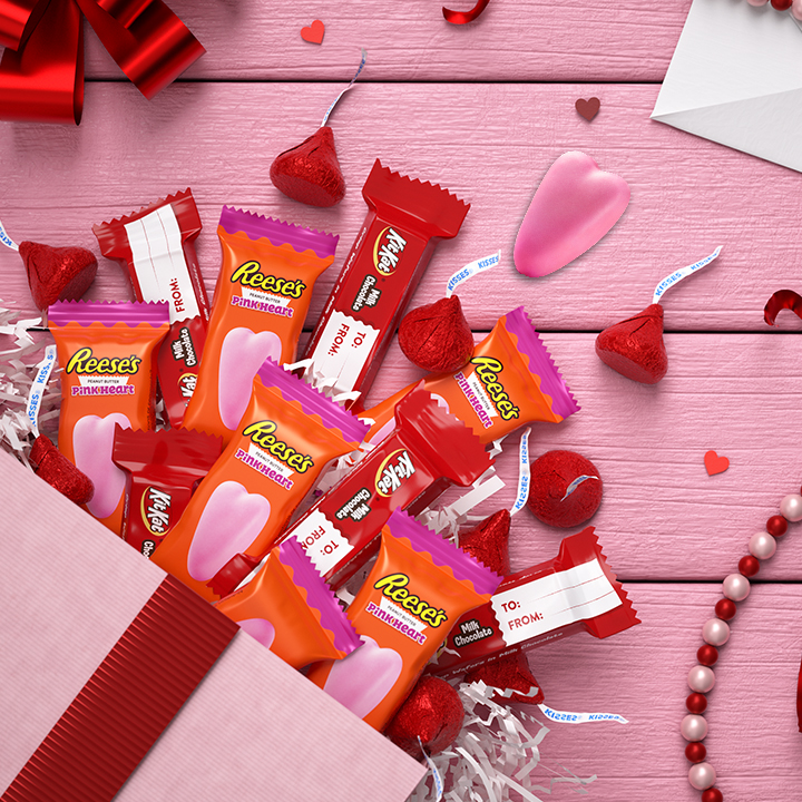 Variety of full-size Hershey's wrapped candies inside red and pink gift box